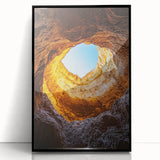 Framed acrylic wall art showcasing a stunning landscape design with cave formations, presented in a sleek black frame, ideal for modern home decor.