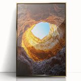 Framed acrylic artwork showcasing a stunning landscape view of caves with a gold front, ideal for home decor and adding elegance to any space.