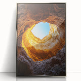 Framed acrylic artwork showcasing a stunning landscape with intricate cave formations, featuring a sleek silver frame that enhances the visual appeal and complements modern decor.