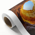 Rolled canvas artwork showcasing a vibrant landscape scene with intricate cave formations, featuring rich colors and textures, ideal for home decor.