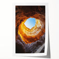 Rolled art print depicting a stunning landscape featuring intricate cave formations and vibrant colors, elegantly packaged in a protective cardboard tube for easy display.