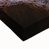 Close-up of a stretched canvas showcasing a vibrant landscape design featuring intricate caves and natural formations, ideal for enhancing home decor with artistic flair.