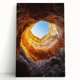 Stretched canvas artwork depicting a vibrant landscape with intricate cave formations in warm hues, perfect for adding a natural touch to any space.