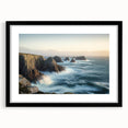 Framed landscape art print depicting dramatic cliffs against a serene sky, featuring a sleek black mat and frame, perfect for modern home decor.