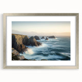 Framed landscape artwork depicting majestic cliffs in silver frame with matting, showcasing intricate details and vibrant colors, ideal for home decor enhancement.
