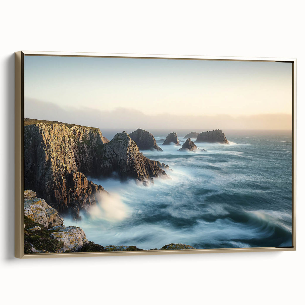 Framed canvas artwork depicting a stunning landscape of cliffs in vibrant colors, accented with a gold frame, showcasing a modern aesthetic for home decor.