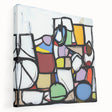 Abstract geometric stretched canvas artwork, showcasing vibrant shapes and colors, elegantly displayed in a side view, perfect for modern home decor.