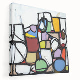Abstract geometric stretched canvas artwork, showcasing vibrant shapes and colors, elegantly displayed in a side view, perfect for modern home decor.