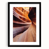 Framed landscape print showcasing vibrant canyons in rich earth tones, set within a sleek black mat, ideal for enhancing modern home décor.