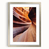 Landscape artwork showcasing a canyon scene, elegantly framed in silver with a mat. The image emphasizes the intricate details of the landscape, ideal for home decor.