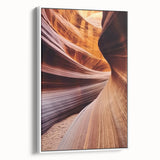 Framed canvas artwork showcasing a stunning landscape of canyons in warm earth tones, displayed from a white side view, perfect for home décor and nature enthusiasts.