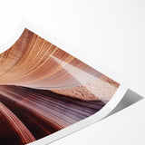 Stunning landscape print of colorful canyons in warm hues, displayed in a rolled format, ideal for home decor. Perfect for adding a vibrant touch to any room.