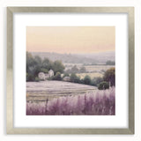Framed landscape wall art depicting a serene countryside scene, featuring lush green fields and a tranquil sky, accented by a silver mat and frame. Ideal for home decor.