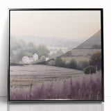 Framed landscape wall art depicting a serene countryside scene with lush greenery and rolling hills, presented in a sleek black frame, perfect for home decor.