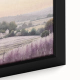 Close-up of a beautiful framed canvas wall art depicting a serene countryside landscape with vibrant green fields and a blue sky, perfect for home decor.