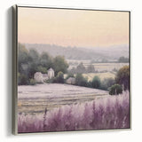 Framed landscape wall art depicting a serene countryside scene, showcasing vibrant greens and soft blue skies with a sleek silver frame, ideal for home decor.