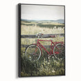 Framed canvas artwork showcasing a serene countryside landscape with vibrant green fields and a tranquil sky, presented in a sleek black frame, ideal for home decor.