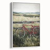 Framed canvas artwork showcasing a serene countryside landscape, highlighting lush green fields and a clear blue sky, presented in a sleek white frame for an elegant touch.