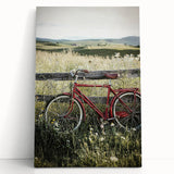 Stretched canvas artwork depicting a serene countryside landscape, featuring rolling hills and lush greenery, leaning against a neutral wall for display. Ideal for home decor enthusiasts seeking nature-inspired art.