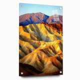 Desert landscape acrylic artwork displayed in a clear glass frame, showcasing vibrant colors and intricate details, with decorative pins enhancing its aesthetic appeal.