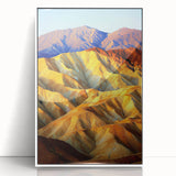 Framed acrylic artwork depicting a vibrant desert landscape with warm hues of orange and yellow, showcased in a sleek white frame, ideal for modern home decor.