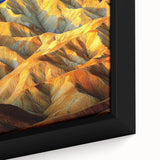 Close-up of a framed canvas artwork depicting an intricate desert landscape with warm earthy tones, showcasing unique textures and fine details that enhance the visual experience. Perfect for adding a touch of nature-inspired elegance to any room.