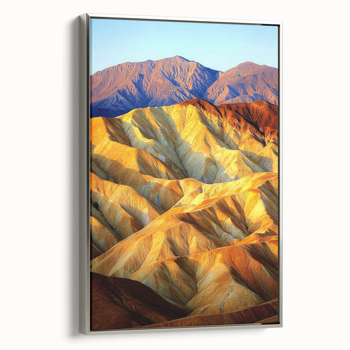 Framed canvas artwork showcasing a desert landscape, featuring warm hues of orange and brown, with a sleek silver frame enhancing its contemporary aesthetic. Perfect for home or office decor, this piece brings a serene desert vibe to any space, making it an ideal choice for nature lovers.