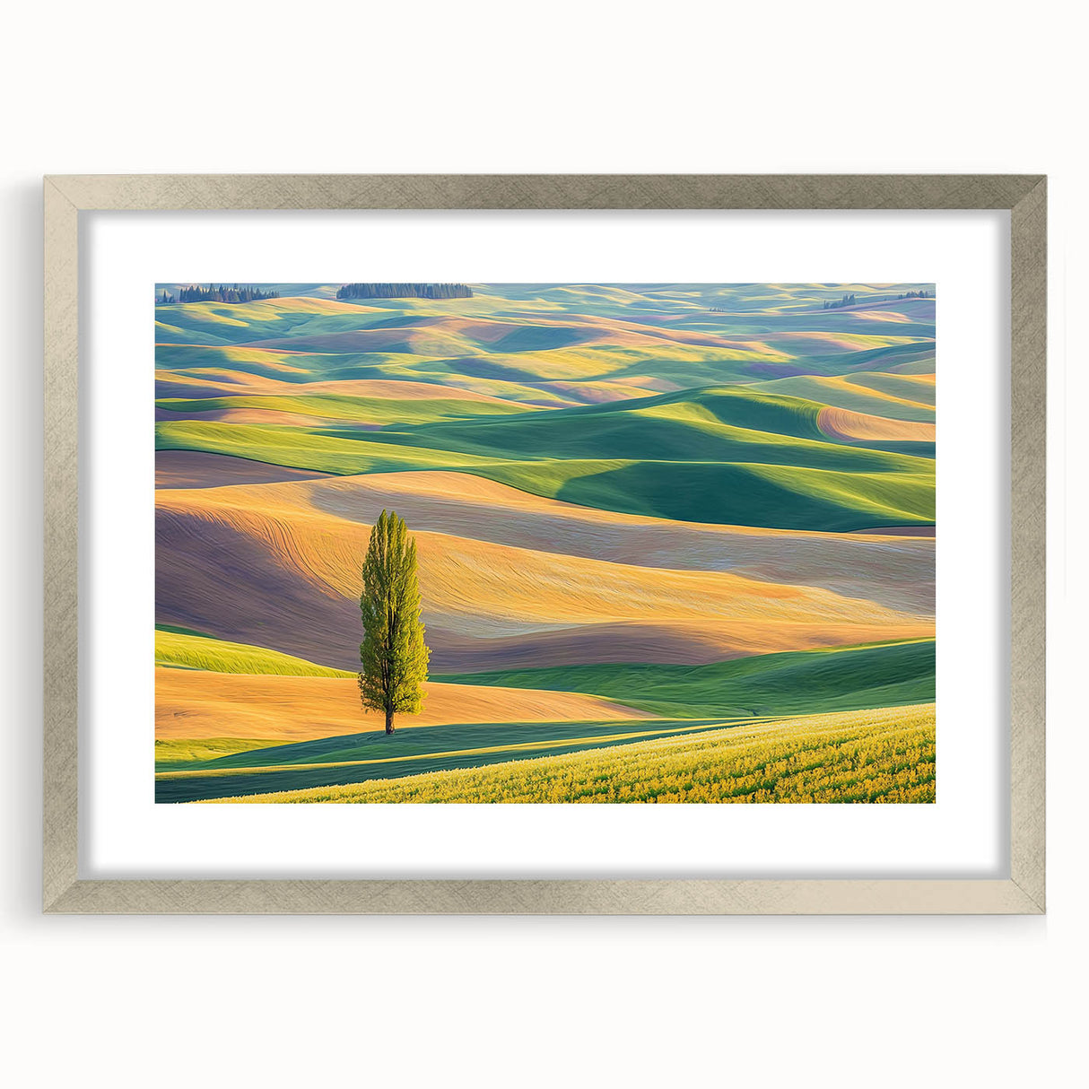 Framed landscape artwork featuring vibrant green fields and a serene blue sky, elegantly presented with a silver mat and frame, perfect for home decor.