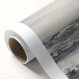 Rolled canvas showcasing a vibrant landscape design with rich colors and intricate details, securely packaged in a protective cardboard tube for delivery.