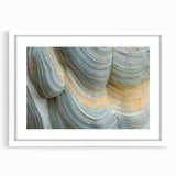Abstract art print of vibrant florals in white frame, suitable for bedroom or dining room decor.
