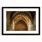 Elegant black-framed landscape artwork showcasing a majestic castle surrounded by lush greenery, featuring a white mat for a refined presentation, perfect for home decor.