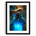 Framed landscape artwork showcasing a serene cave scene, featuring a black mat and sleek frame, perfect for home decor or office ambiance, enhancing any space with nature's beauty.