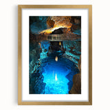 Elegant gold-framed landscape artwork featuring a serene cave scene with intricate details and a soft mat, ideal for enhancing home decor aesthetics.