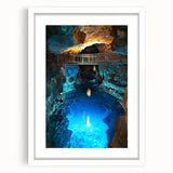 Framed landscape artwork featuring a serene cave scene, presented with a white mat, ideal for modern home decor. The design highlights earthy tones and intricate details, perfect for creating a calming atmosphere.