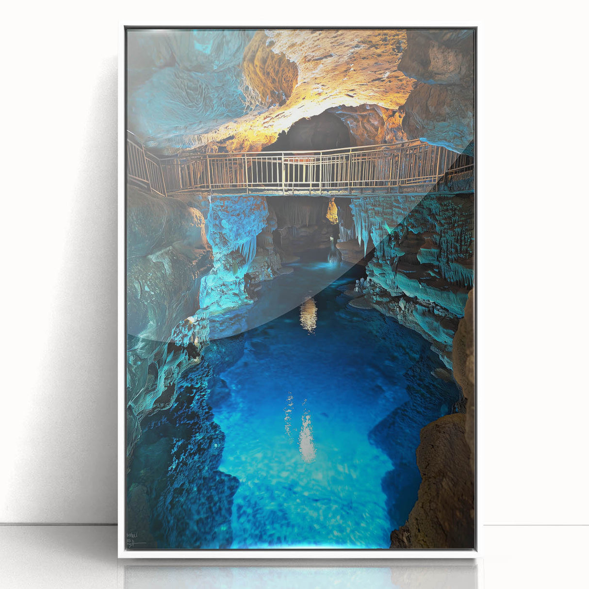 Framed acrylic artwork showcasing a stunning landscape with intricate cave details, set against a clean white border, perfect for modern home decor.