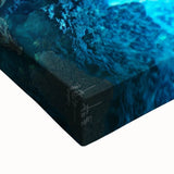 Close-up of a textured canvas print depicting an intricate landscape scene with caves, showcasing vibrant colors and detailed brushwork, perfect for home decor.