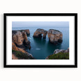 Black-framed landscape artwork showcasing dramatic cliffs and serene skies, presented with a white mat for an elegant finish, ideal for modern home decor.