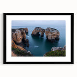 Black-framed landscape artwork showcasing dramatic cliffs and serene skies, presented with a white mat for an elegant finish, ideal for modern home decor.