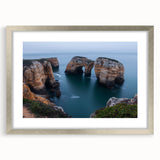 Silver-framed landscape artwork showcasing dramatic cliffs with a mat border, ideal for enhancing modern home decor, adding elegance to any room.