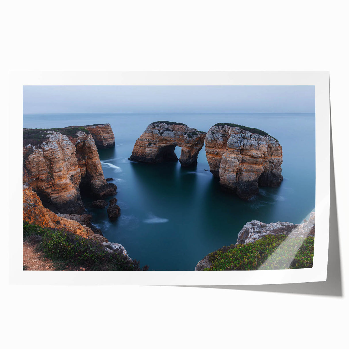 Vibrant rolled print showcasing a dramatic cliff landscape under a sunset sky, perfect for home decor or art enthusiasts, packaged securely in a protective tube.