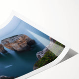 Stunning landscape print showcasing dramatic cliffs against a vibrant sunset, rolled and ready for display, highlighting natural beauty and artistic flair.