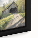 Close-up of a black framed canvas featuring a textured, colorful depiction of a covered bridge, ideal for living room decor.