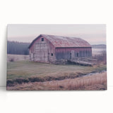 Stretched canvas print depicting a serene landscape with a rustic barn surrounded by lush greenery, ideal for farmhouse decor enthusiasts.