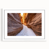 Landscape print featuring a vibrant canyon scene, framed with a white mat, showcasing rich earthy tones and intricate details, perfect for home decor.