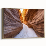 Framed canvas artwork depicting a stunning landscape of canyons, featuring rich gold accents and a side view that highlights its elegant design, perfect for home decor.