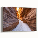 Framed landscape canvas art showcasing vibrant canyons in rich earth tones, elegantly mounted with a sleek silver frame, perfect for home decor enhancement.