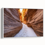 Framed canvas artwork depicting a stunning landscape of canyons in vibrant colors, showcasing intricate details and textures, perfect for home decor. The white frame enhances the piece, making it an eye-catching addition to any room.