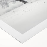 Rolled canvas artwork depicting a serene countryside landscape, showcasing vibrant green fields and a clear blue sky, elegantly packaged in a protective cardboard tube.