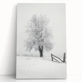 Stretched canvas artwork showcasing a vibrant countryside landscape with rolling hills and a clear blue sky, leaning against a rustic wall, perfect for home decor.