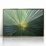 Large art print of close-up floral imagery in soft pastel colors, framed in gold acrylic, suitable for modern nursery decor.